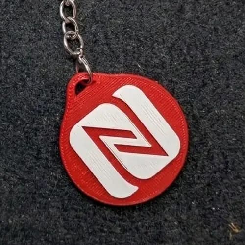 Red 3D-printed Tapora NFC keychain